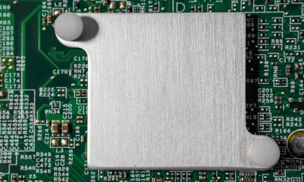 Silver Heatsink Mounted on a Green Circuit Board